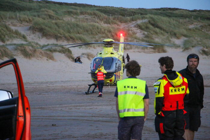 Hardloper onwel op strand