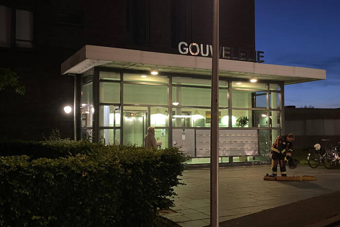 Brand in flat door wasmachine