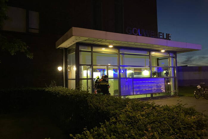 Brand in flat door wasmachine