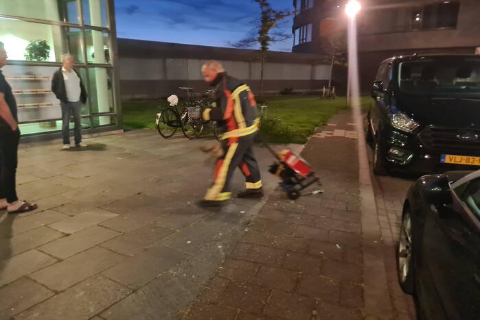 Brand in flat door wasmachine