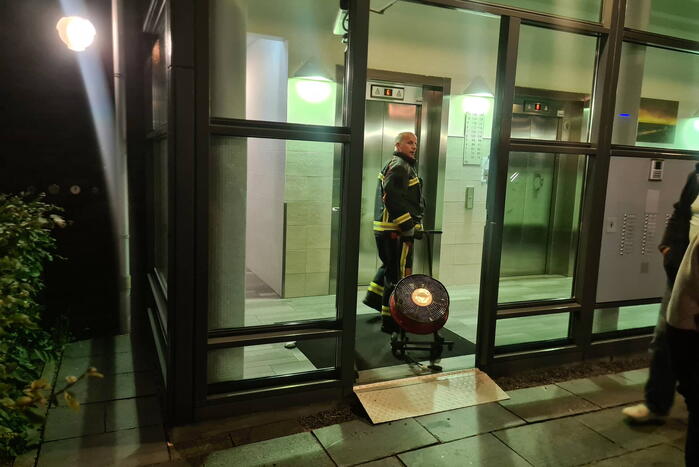 Brand in flat door wasmachine