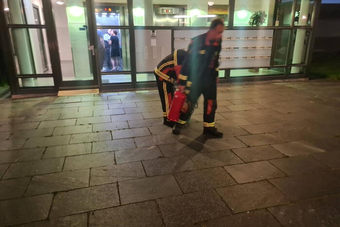 Brand in flat door wasmachine