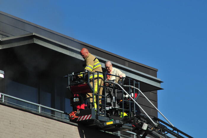 Personen uit brandende bovenwoning gered