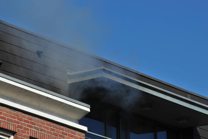 Personen uit brandende bovenwoning gered