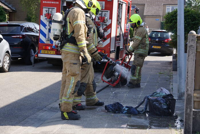 Wasmand gaat in vlammen op