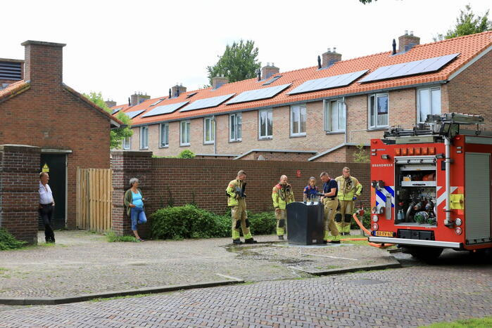 Ondergrondse container in brand