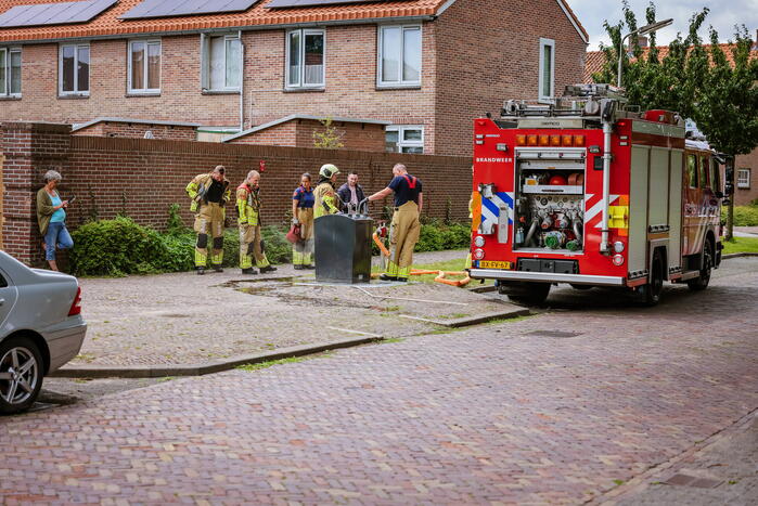 Ondergrondse container in brand