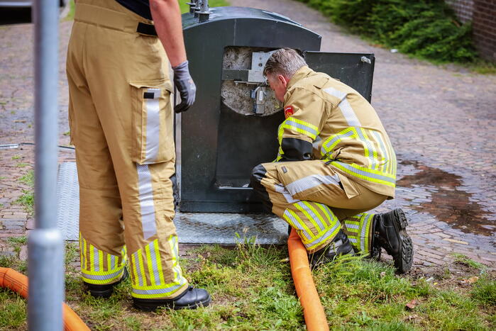 Ondergrondse container in brand