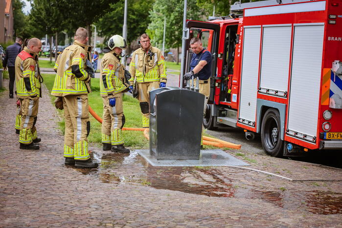 Ondergrondse container in brand