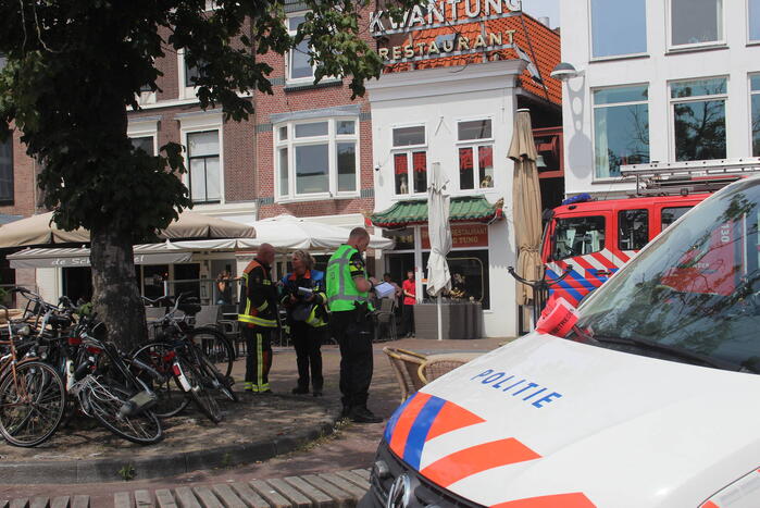 Brand op dak van grachtenpand