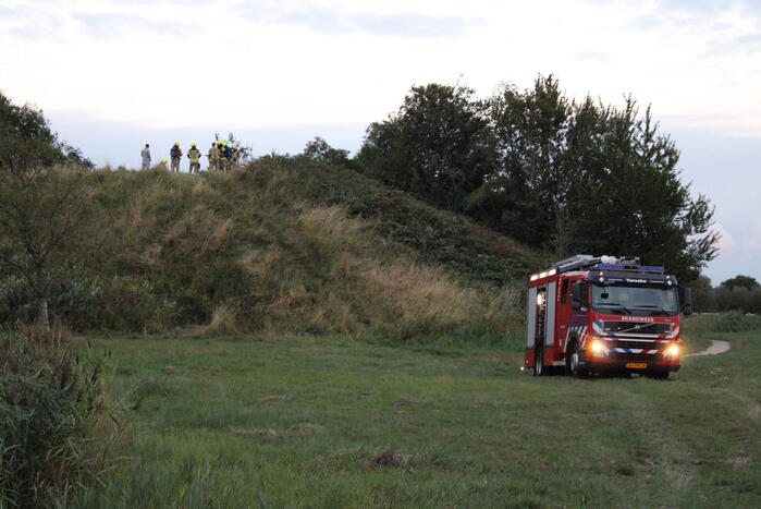 Pallets boven op berg in brand gevlogen