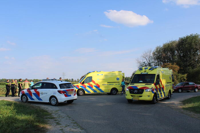 Scootmobiel en racefietser botsen op elkaar