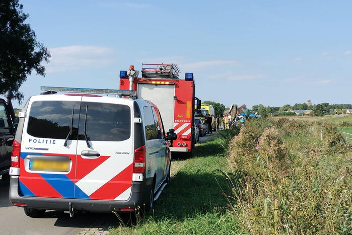 Scootmobiel en racefietser botsen op elkaar