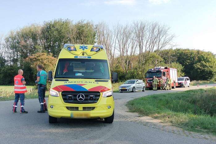 Scootmobiel en racefietser botsen op elkaar