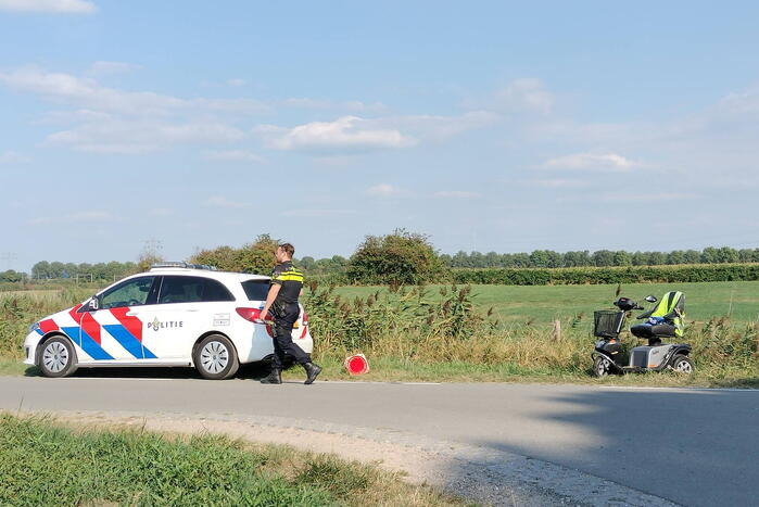 Scootmobiel en racefietser botsen op elkaar