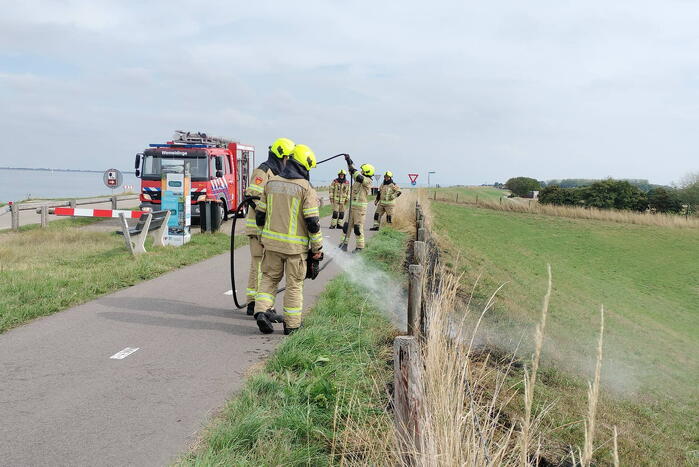 Afrastering beschadigd vanwege brand