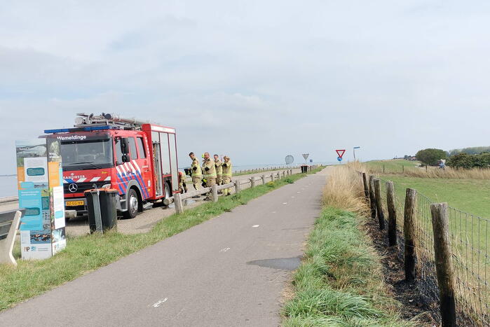 Afrastering beschadigd vanwege brand