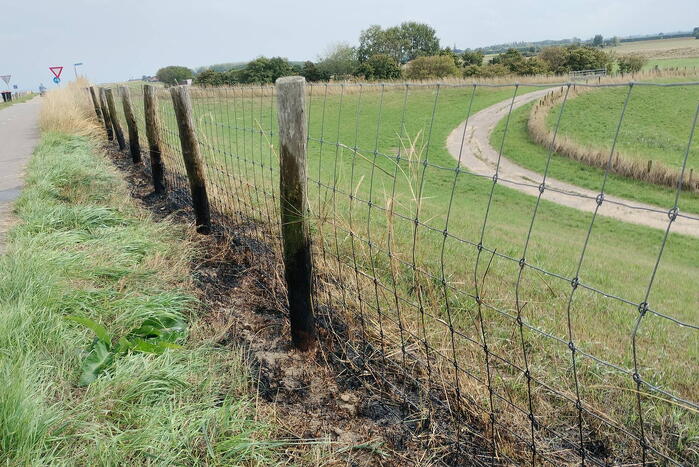 Afrastering beschadigd vanwege brand