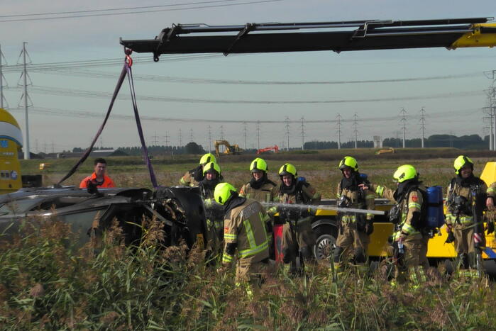 Auto total-loss vanwege brand in motorcompartiment