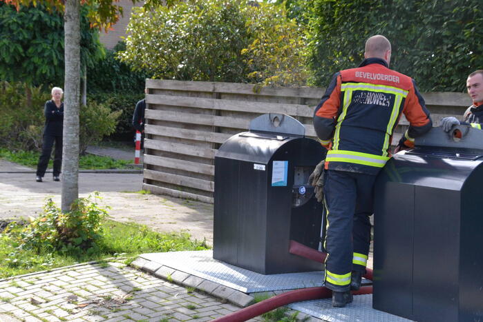 Ondergrondse container in brand