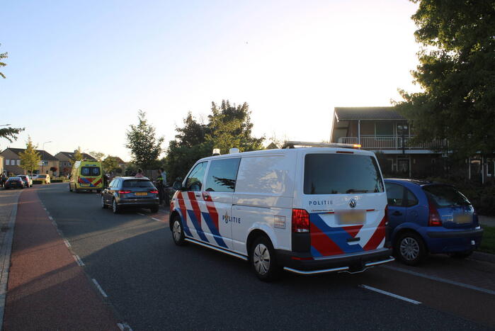 Fietser en automobilist in botsing