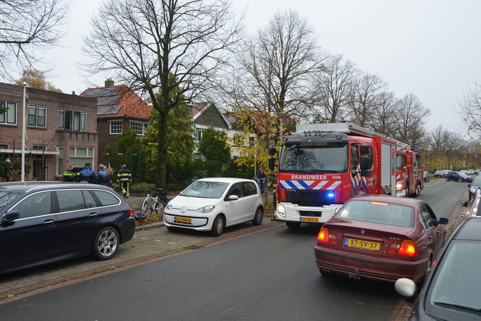 Prullenbak vat vlam in woning