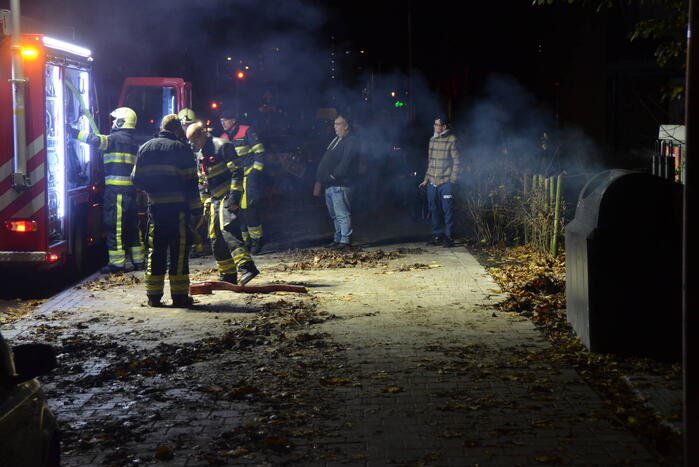 Veel rook door brand in container