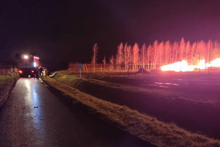 Stapel hout in brand