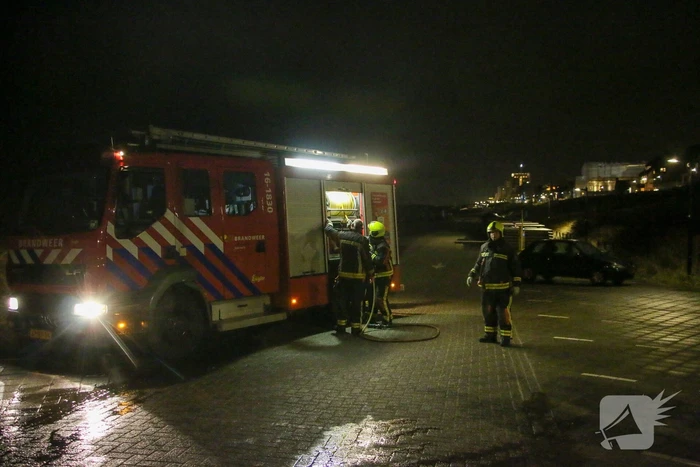 Stapel kerstbomen in brand