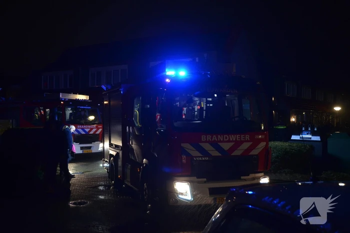 Brand in portiek woning