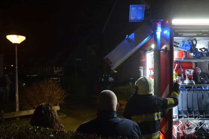 Brand in portiek woning