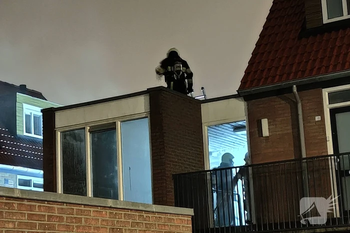 Brand in portiek woning
