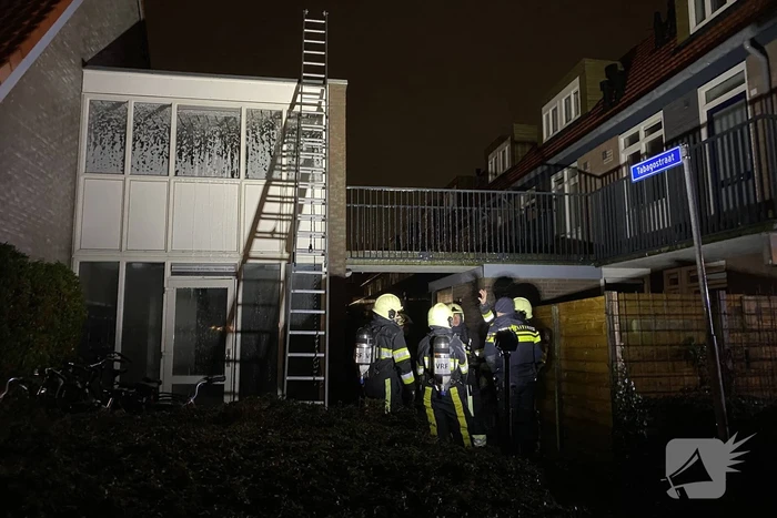 Brand in portiek woning