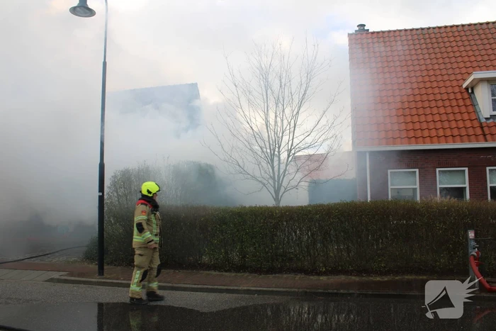 Tuinhuis vat vlam