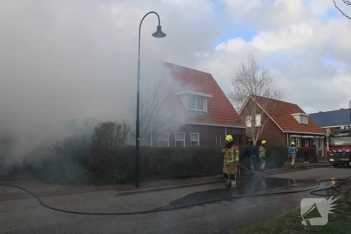 Tuinhuis vat vlam