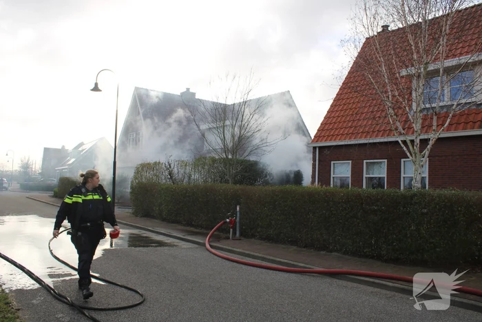 Tuinhuis vat vlam