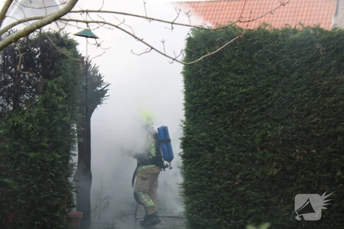 Tuinhuis vat vlam