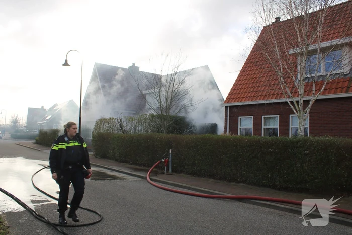 Tuinhuis vat vlam