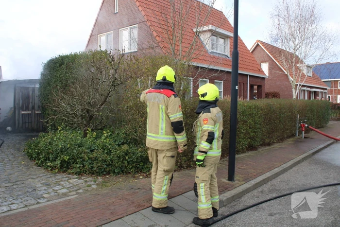 Tuinhuis vat vlam