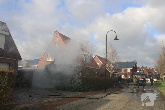 Tuinhuis vat vlam