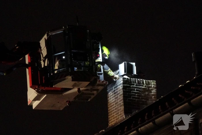 Schoorsteen geveegd na brand
