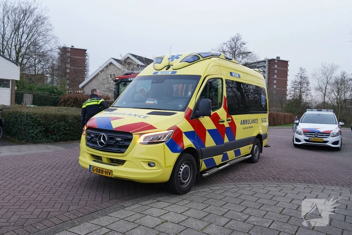 Kind met voet vast tussen spaken van fiets