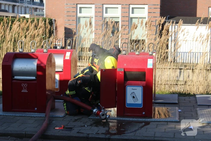 Brand in ondergrondse papiercontainer