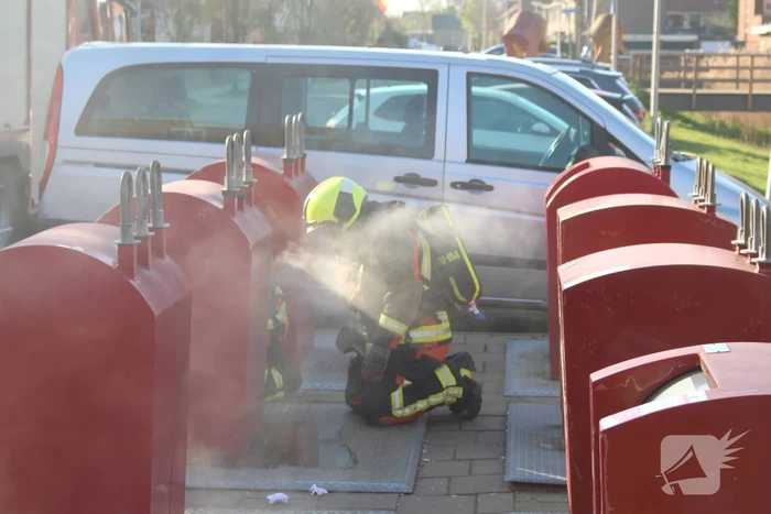 Brand in ondergrondse papiercontainer