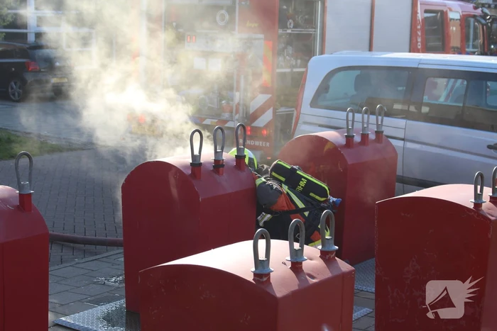 Brand in ondergrondse papiercontainer