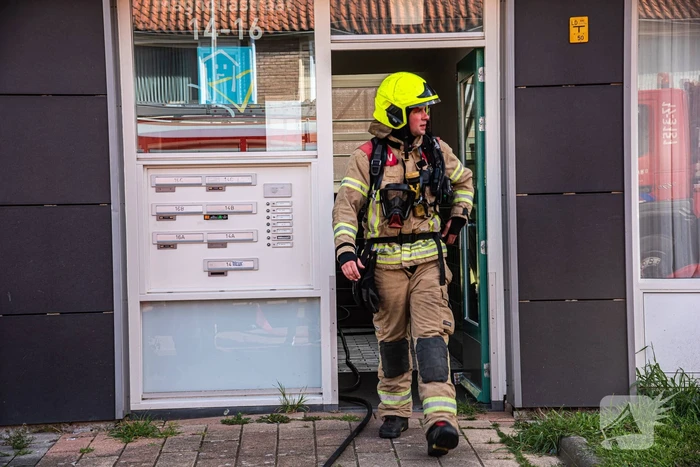 Brand in slaapkamer van portiekwoning
