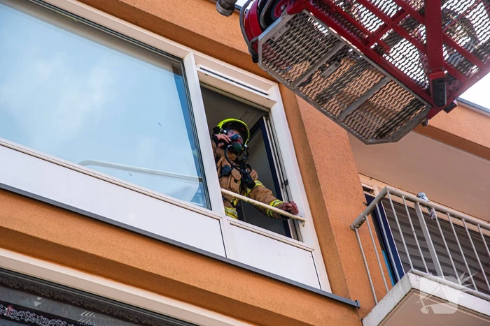 Brand in slaapkamer van portiekwoning