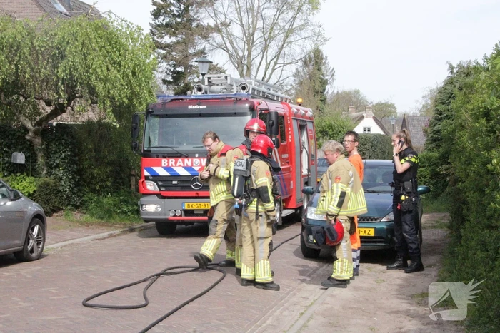 Laadruimte vuilniswagen vat vlam