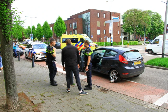 Schade na botsing op kruising