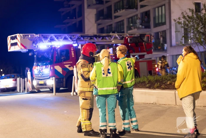 Gezin van balkon gered na brand